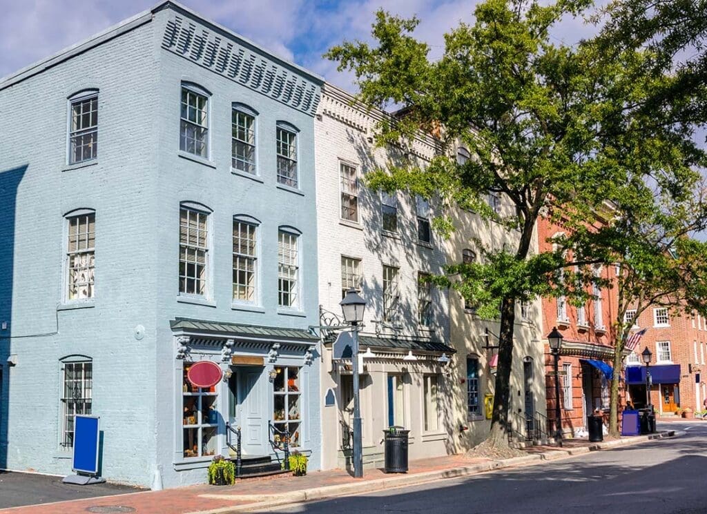 Insurance by Industry - Row of Older Brick Small Business Shops on a Main Street in Old Town Alexandria Virginia with Green Trees