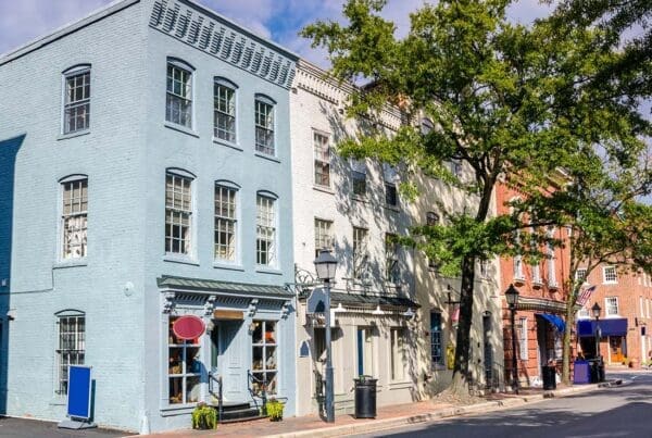 Insurance by Industry - Row of Older Brick Small Business Shops on a Main Street in Old Town Alexandria Virginia with Green Trees