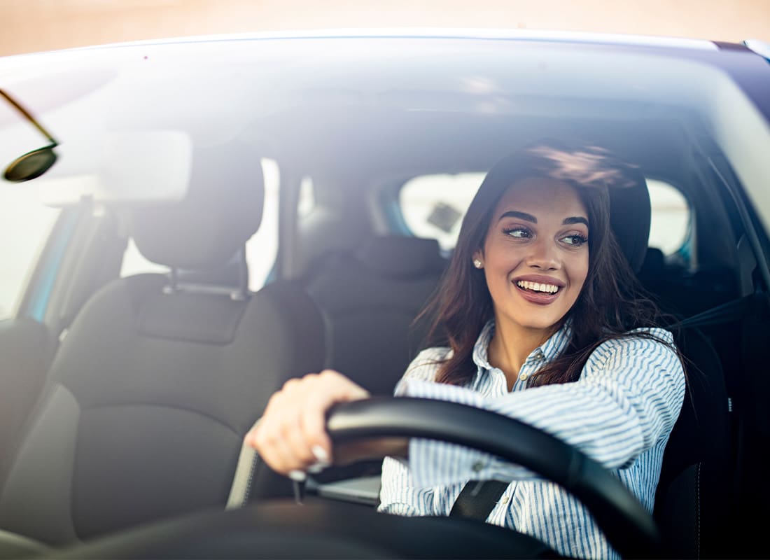 Cheap Car Insurance Pennsylvania - Woman Driving Car Sun Reflecting on Windshield