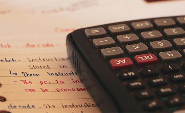 Virginia Renters Insurance - Calculator Resting on Lined Paper Notes